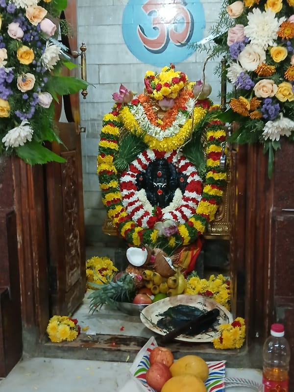 Hindu shrine with flower garlands observed in Bengaluru