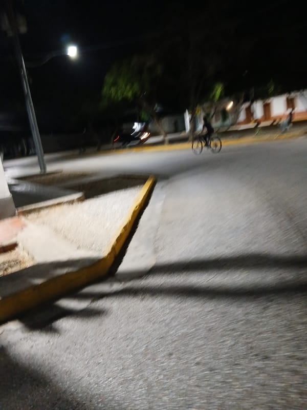 Late-night scenes around a Santa Ana plaza and volleyball court