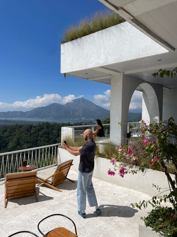 Terrace views and phone cameras at Kintamani's volcanic lookout