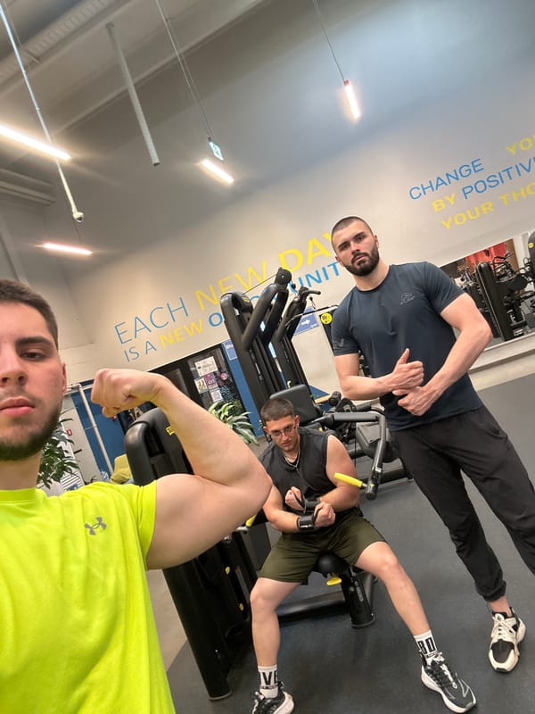 Men pose and exercise at Sofia gym