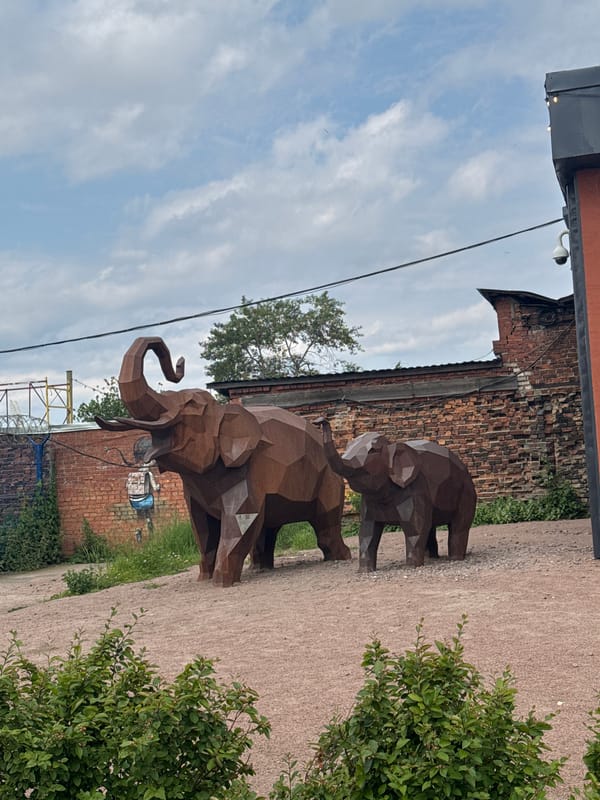 Metal elephant sculptures and pedestrian walkway documented in Saint Petersburg