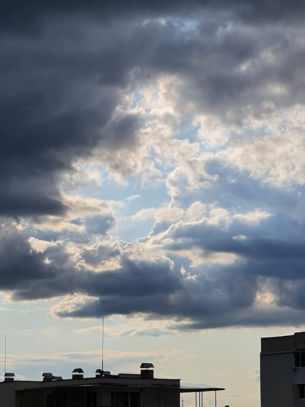 Storm clouds and sunlight compete over Sofia's sky