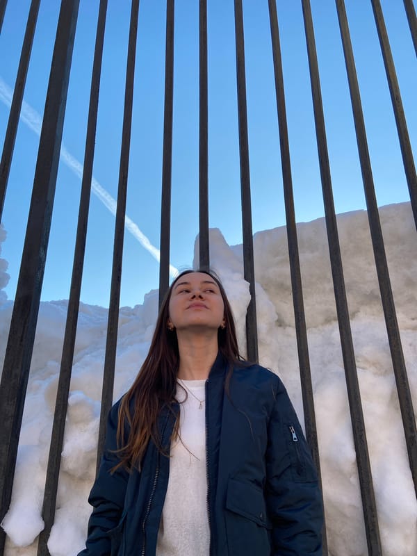 Young woman tours Izhevsk landmarks on sunny winter afternoon