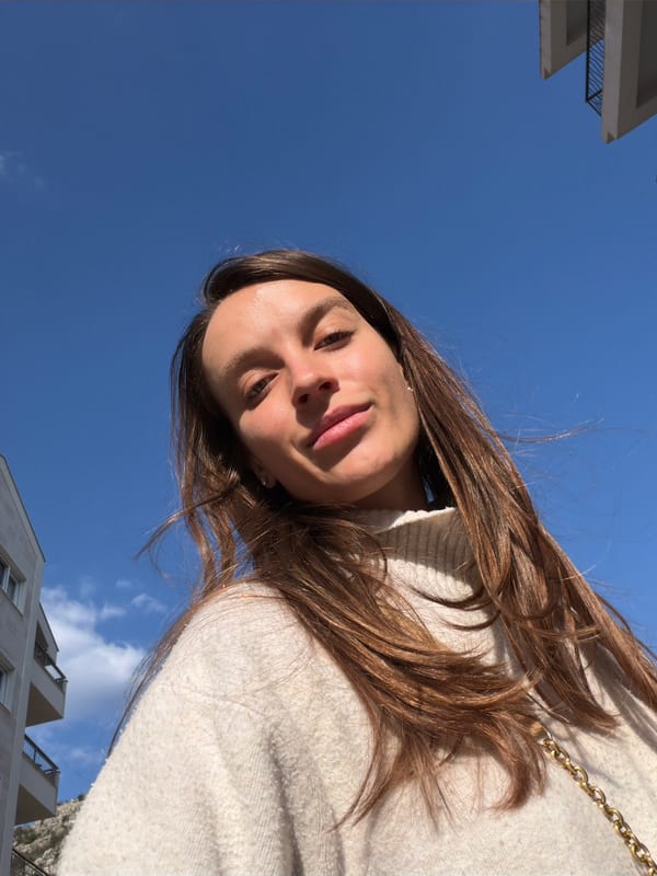Woman in white hoodie photographed in Budva, Montenegro