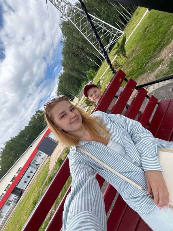 Woman and child enjoy morning park visit in Podosenikha
