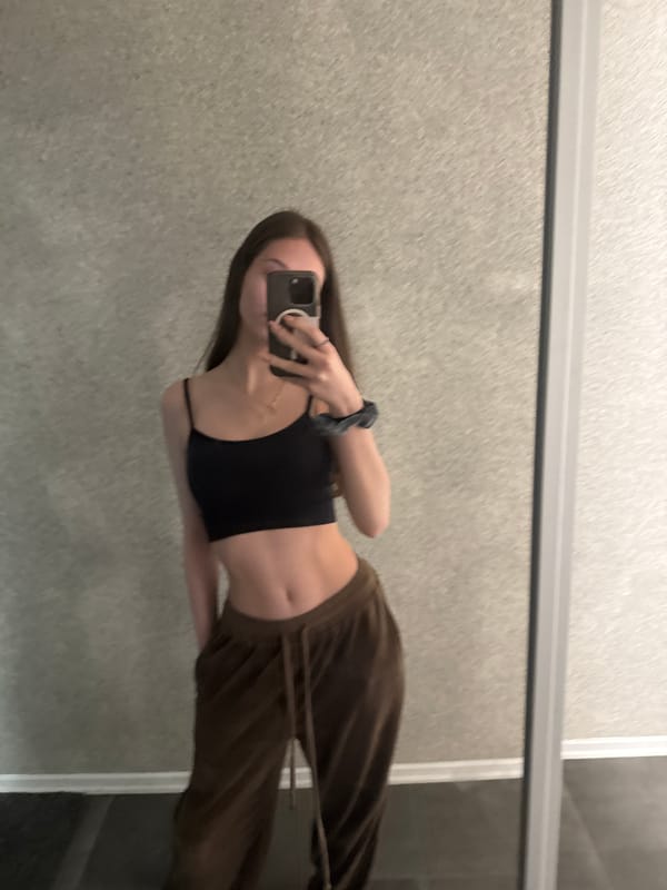Woman takes mirror selfie in Sofia apartment