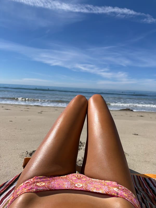 Beach visitor spotted in pink bikini at Malibu coast