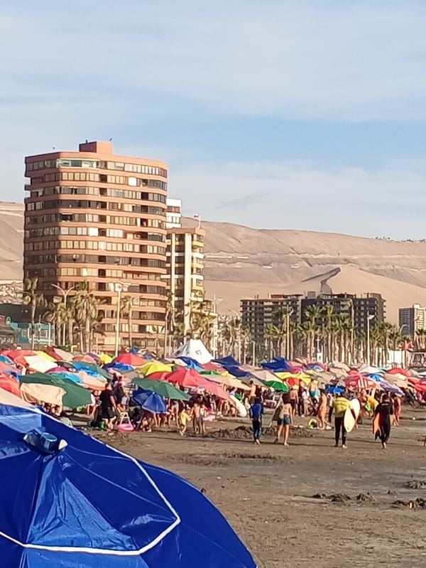 Crowded beach scene captured in Iquique, Chile