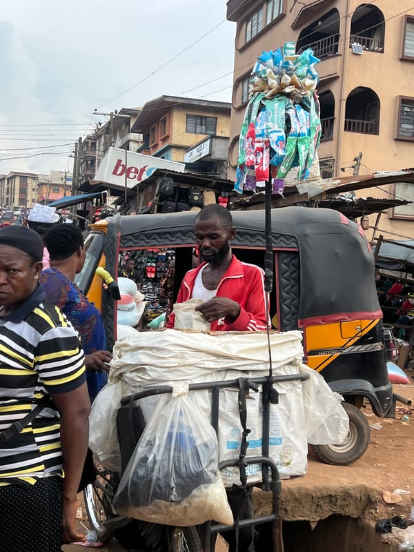 Nkpor street market buzzing with commerce and transit activity