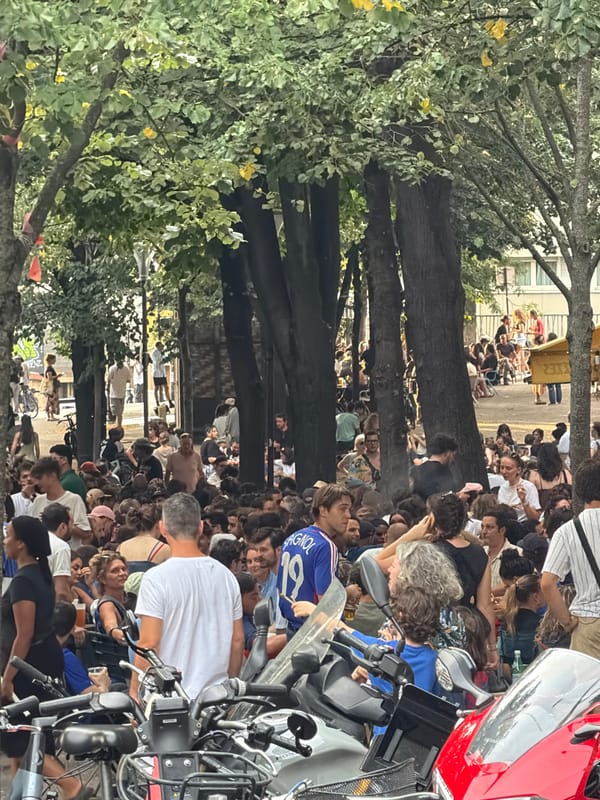 Bastille Day crowds fill Paris streets and café terraces