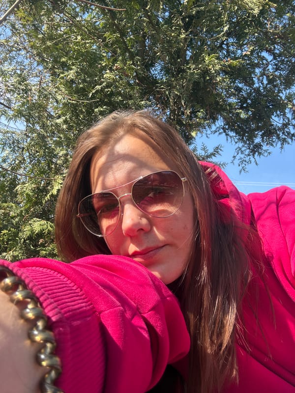 Woman photographs spring morning in Dmitrov park