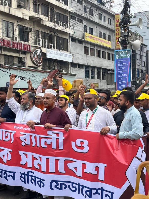 Men in traditional attire gather for demonstration in Dhaka