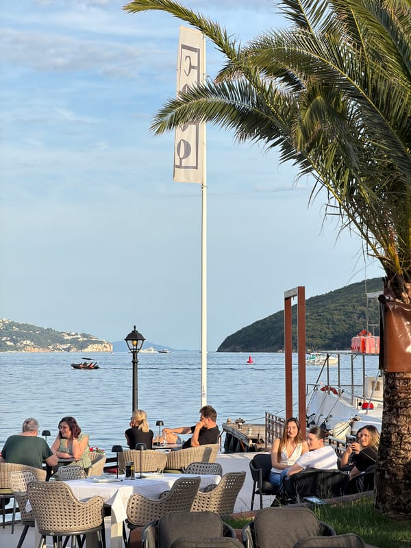 Tourist explores Budva's Old Town, beaches and Ferris wheel