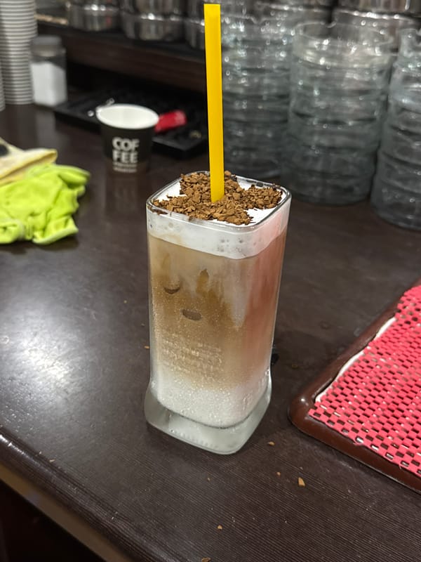 Iced coffee and a hashtag graphic from Sredets
