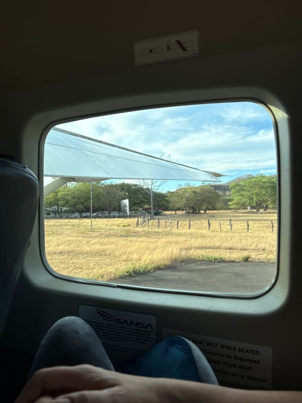 Aircraft passengers document airport views in Costa Rica
