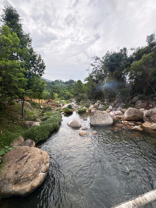 Swimmers enjoy natural pools and waterfalls in Khanh Vinh
