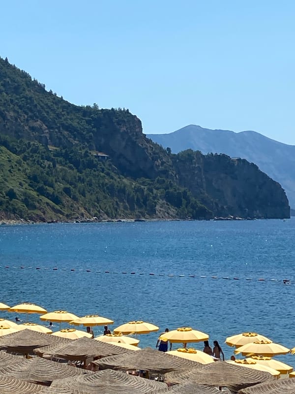 Beach umbrellas and seaside dining on the Montenegrin coast