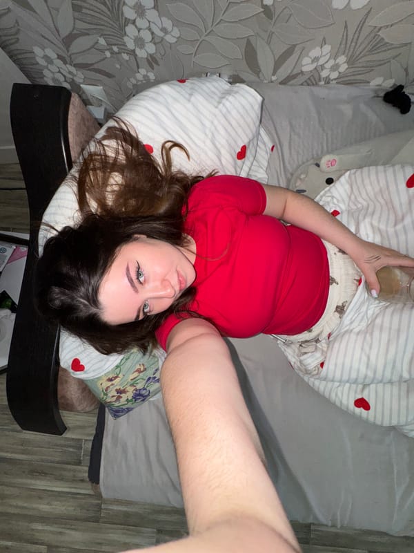 Woman Takes Selfie While Lying Down in Гамово