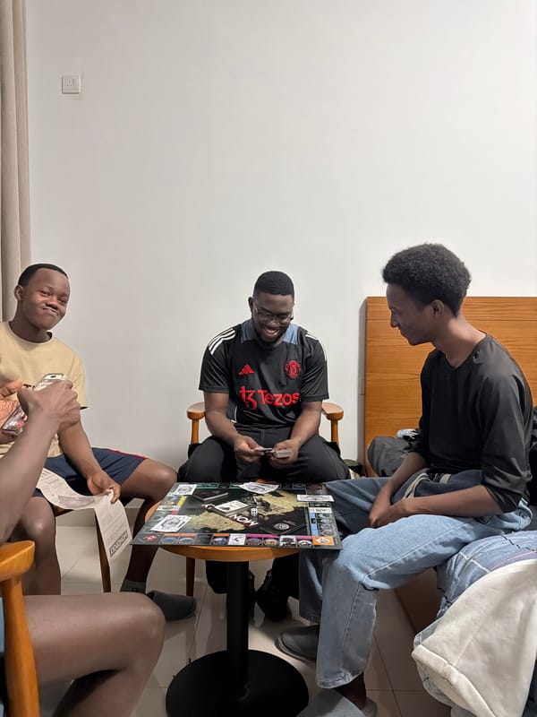 Young men play Monopoly indoors in Nanjing district
