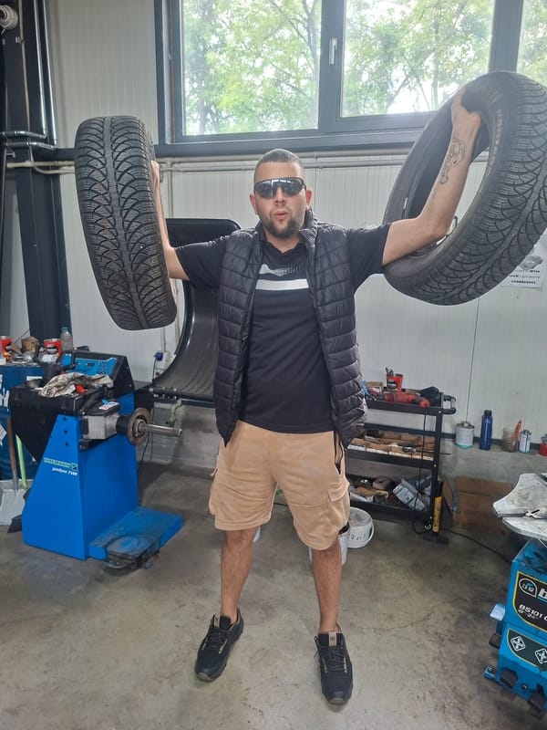 Tire shop worker prepares for weather as rain hits area