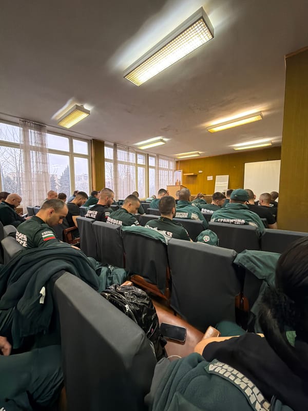 Young men in green gather in Pazardzhik auditorium