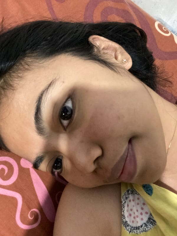 Chilling indoors in Madiun, phone in hand
