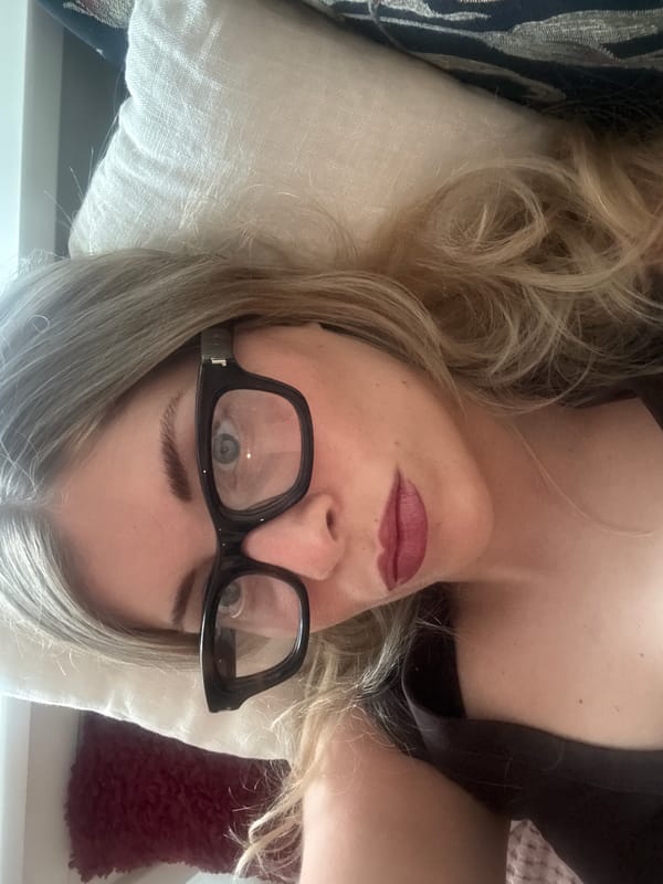 Woman rests indoors in Paris apartment setting