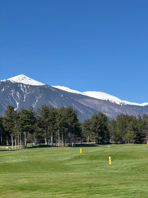 Golf course documented in Razlog, Bulgaria with mountain backdrop