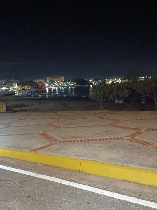 Nighttime scenes documented across Juan Griego harbor and coastline