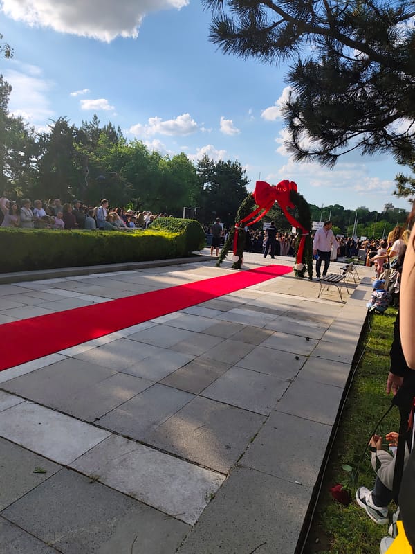 Graduation ceremony held in Dobrich park with decorated archway