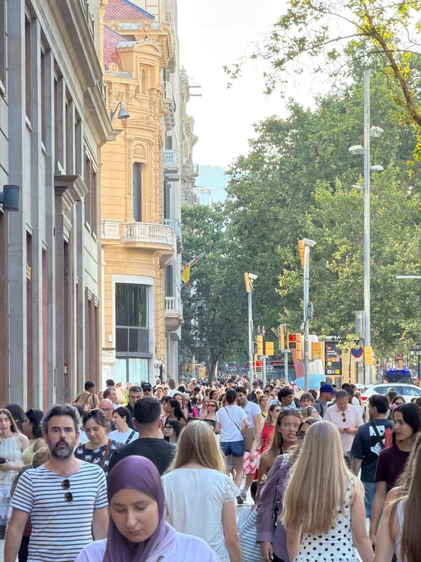 Busy afternoon crowd around Plaça de Catalunya, Barcelona