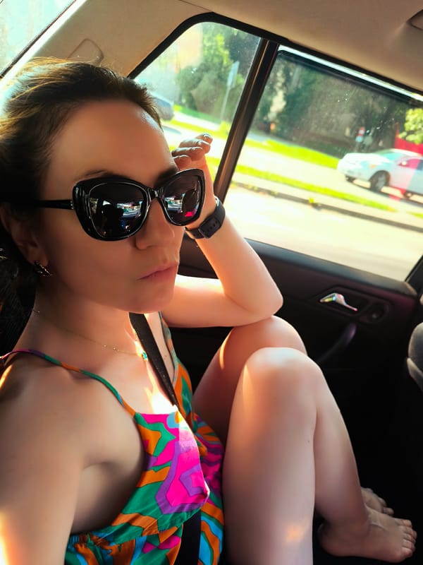 Relaxed in the back seat, mid-ride through Riga