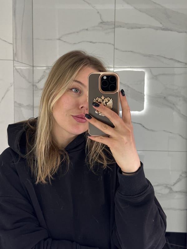 Woman Takes Selfie in Marble Room in Солонцы