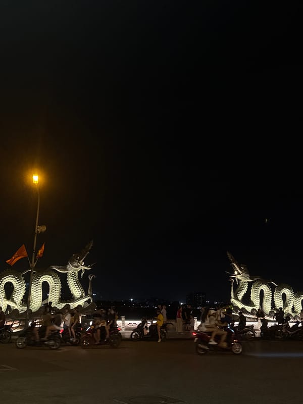 Dragon sculptures spotted on Hà Nội bridge at night