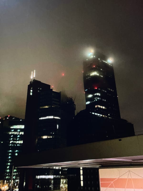 Nighttime urban commute through foggy city streets captured