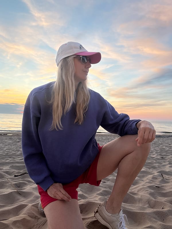 Woman enjoys sunset moment on Riga beach