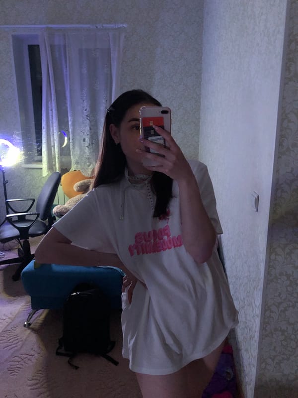 Woman takes selfies in room in Noviy, Russia