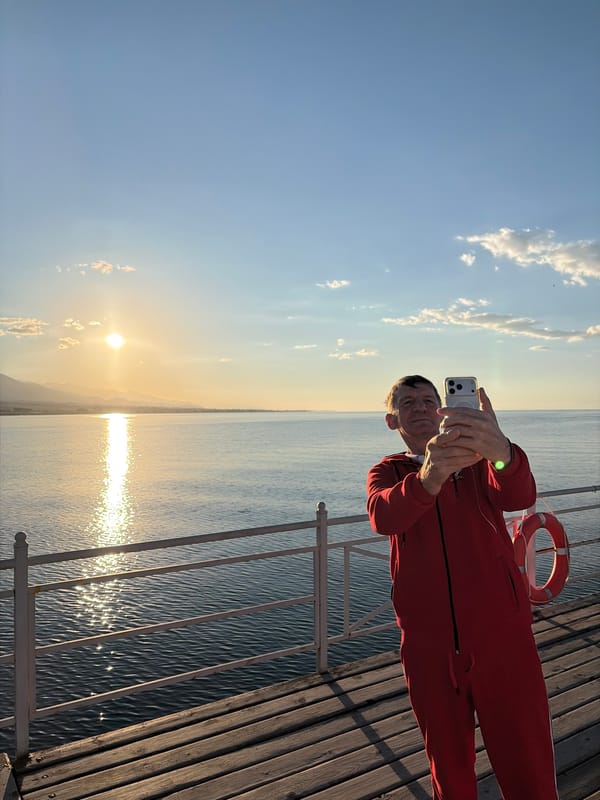 Sunset at a lakeside pier with selfies and scenic views