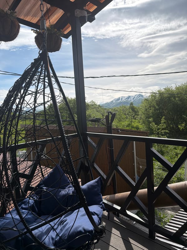 Afternoon at a cozy Sokoch terrace, mountains in the background