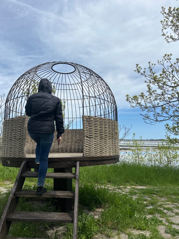 Visitor documents spherical art installation at Burgas waterfront