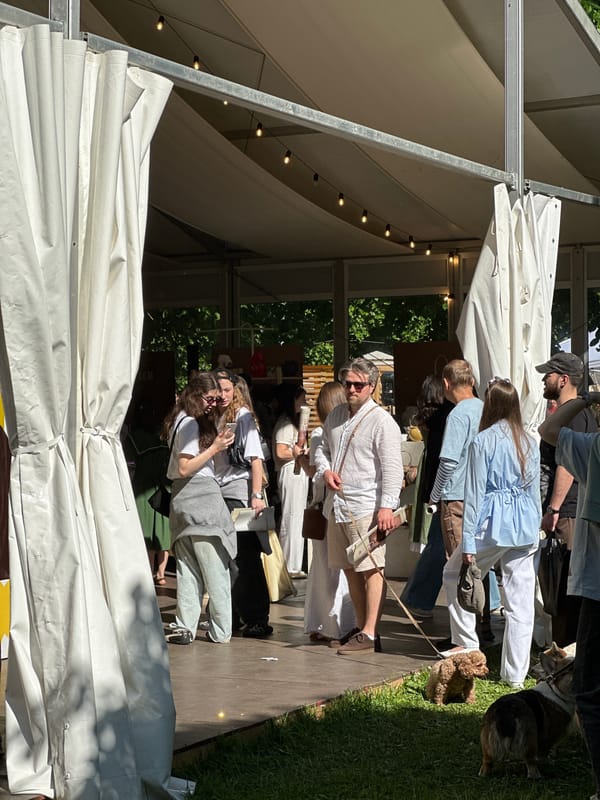 Moscow outdoor market scene captured with illuminated white tent