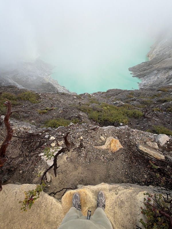Crater rim visit at golden hour, turquoise lake and campfires below
