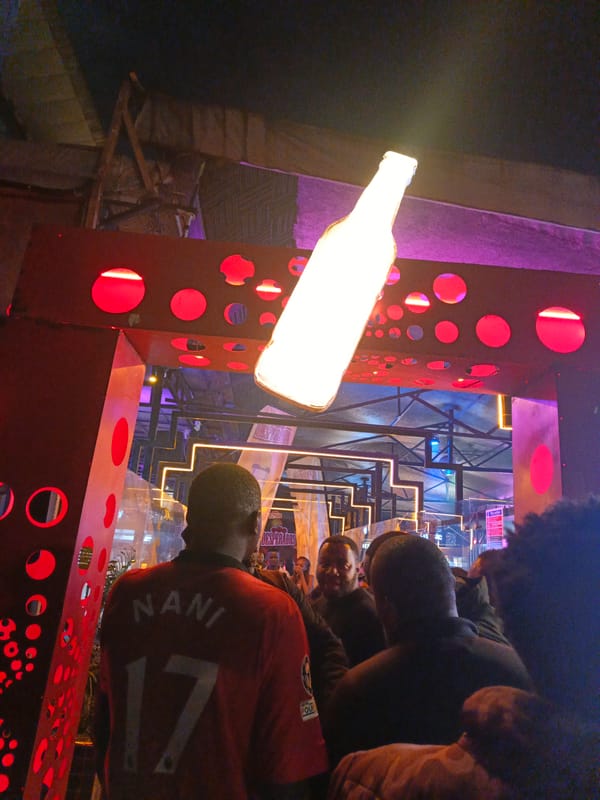 Crowd gathers in Nairobi with person in NANI jersey