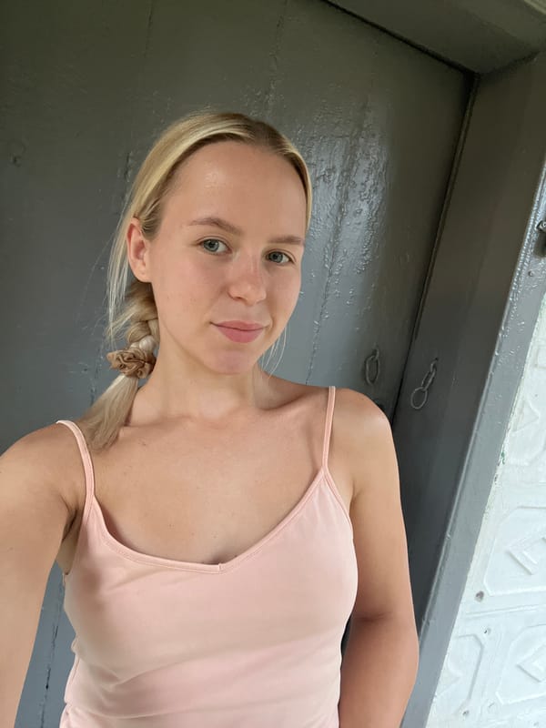 Casual selfie series at a gray door with small accessories