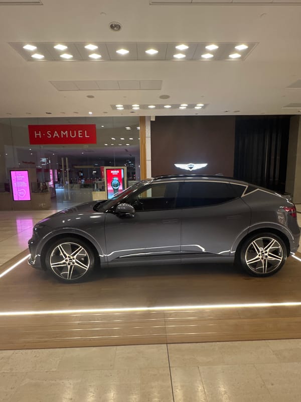 Electric car parked at London shopping mall jewelry store
