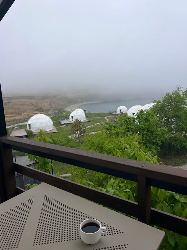 Morning balcony view captures domed structures in Zarubino, Russia