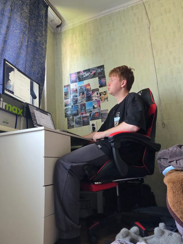 Casual hangout in a Chita bedroom, gaming setup in the background