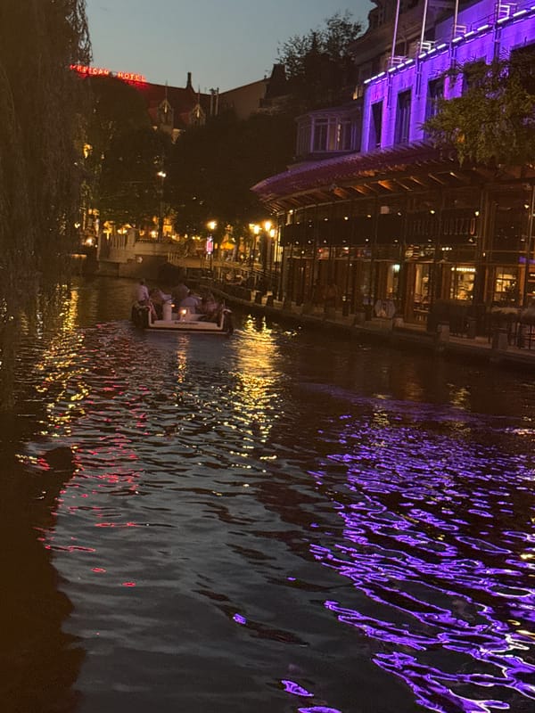 Amsterdam canals and streets come alive after dark