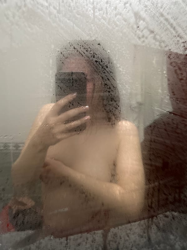 Evening domestic moments: shower time and sleeping cat