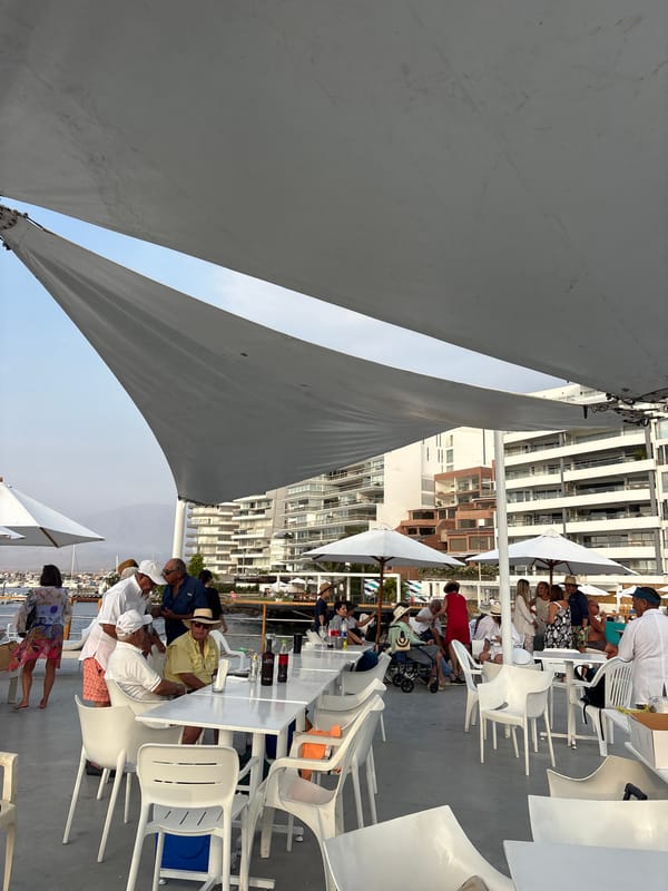 Evening poolside gathering at Yacht Club Ancón draws locals